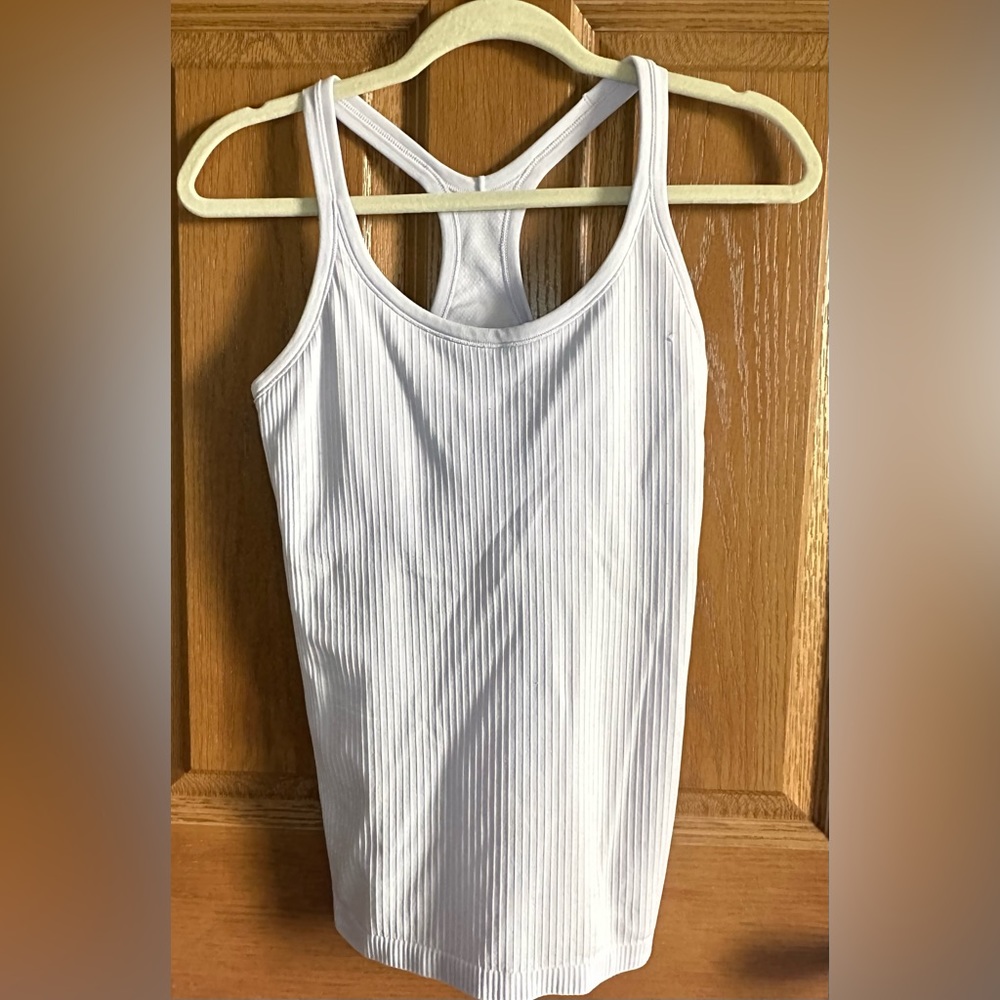 Lululemon EBB TO STREET TANK light lavender in color
Size 8. Next day shipping